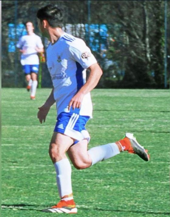 Coach Calyn running during a football match