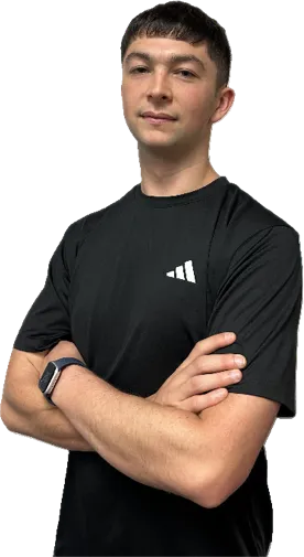 Coach Calyn, personal trainer in Canberra, standing with arms crossed