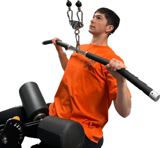 Coach Calyn training on a lat pulldown machine in the gym